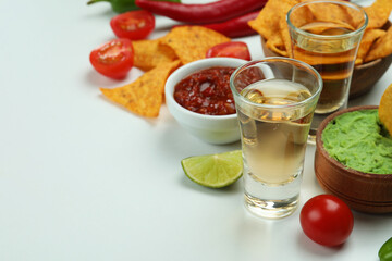 Party concept with tequila, guacamole and chips