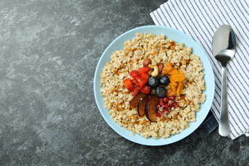 Concept of tasty eating with oatmeal on black smokey background