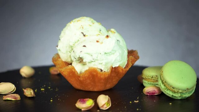Macarons ice cream in snap basket sprinkle dry pistachio crumbs chocolate pieces