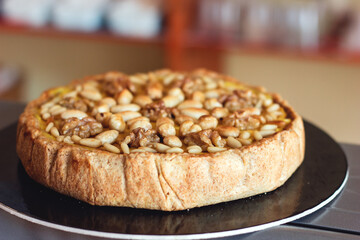 Vegan cake with lemon custard, hazelnuts and walnuts, healthy food