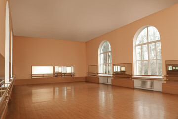 View of empty studio with mirrors and ballet barres