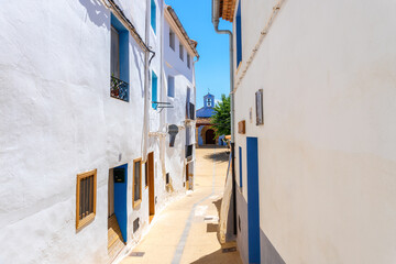 Narrow streets of Chelva, picturesque and brightly painted houses, on a sunny day.