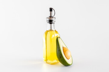 Bottle of avocado essence oil with raw avocado