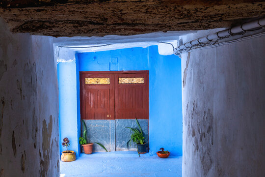 Narrow streets of Chelva, picturesque and brightly painted houses, on a sunny day.