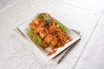 Deep fried crispy golden egg plant with chicken floss appetiser platter in white background appetiser halal menu