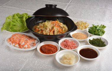 diy Traditional popiah spring roll wrapped with vegetables and prawn in sauce platter set in white background appetiser halal menu