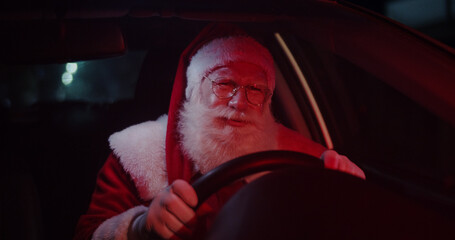 Santa Claus annoyed in car stuck in traffic.