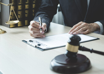 Lawyer hand holding pen and providing legal consult business dispute to the man