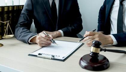 Lawyer hand holding pen and providing legal consult business dispute to the man