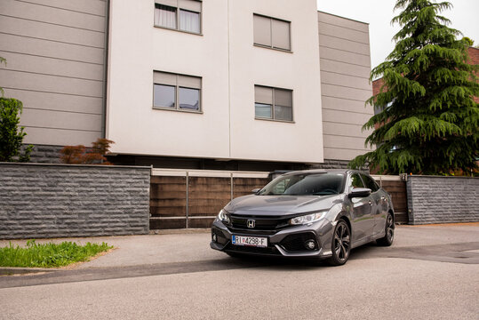 New Honda Civic in grey colour. New Honda design in urban environment. Honda Civic 2019. model.