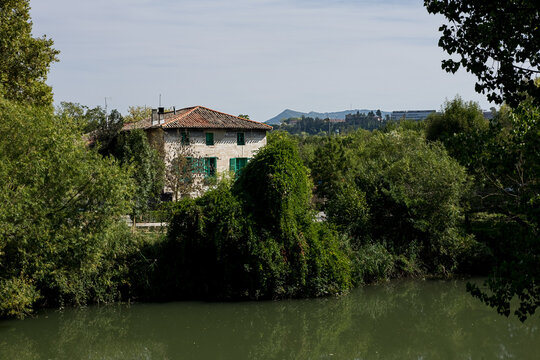 Picturesque house isolated around river arga in Pamplona.