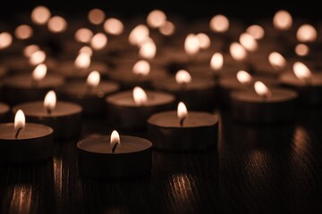 Fototapeta na wymiar beautiful burning candle, bokeh from burning candles, black and white.