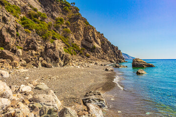 Fototapeta na wymiar Natural coastal landscapes on Kos Island Greece mountains cliffs rocks.