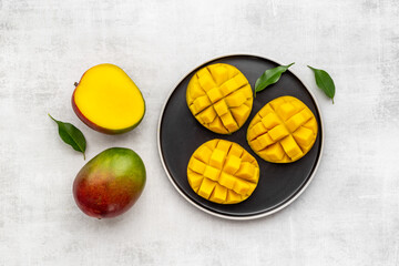Mango slices and cubes in plate for fresh summer dinner
