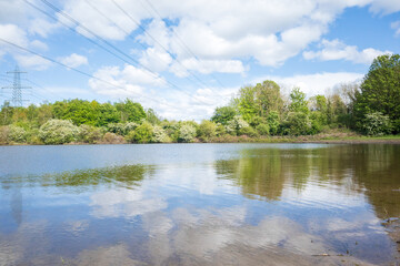 Newburn UK: 24th May 2021: Flooded farmland at Throckley Reef (Reigh) in North England. Flooded field with electricity pylons