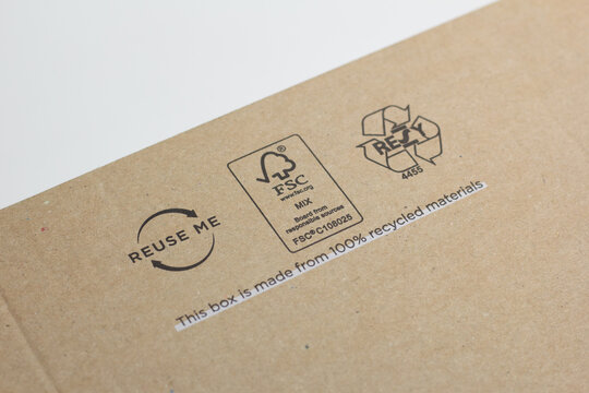 Katowice, Poland – July 13, 2021: Closeup of a box made with recycled materials with The Forest Stewardship Council (FSC) certificate.