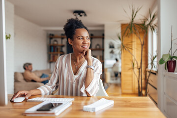 Adult black woman, making sure her company prospers.