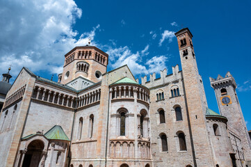 Fototapeta na wymiar Trento, Italy, June 2021. The imposing Cathedral of San Vigilio, rear three-quarter view. Beautiful summer day.