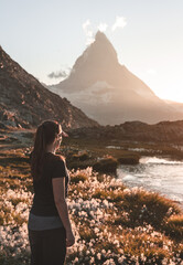 Woman enjoying the view at the famous Matterhorn from the Riffelsee.