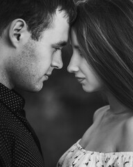 Close up sensual portrait of young couple in love, together, happy, looking at each other. Black and white