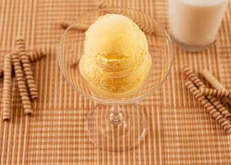 cream ice cream in a bowl with ingredients in the decoration
