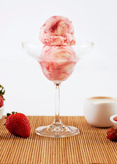 ice cream flavored red fruits in the bowl with ingredients in the decoration
