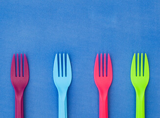 colorful plastic forks on bright surface