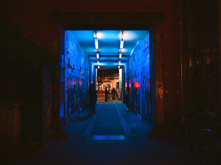 Black light illuminating an alley in Berlin