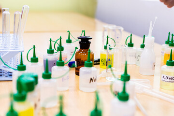 Chemical elements in special containers in a chemical laboratory, flasks with chemicals in a laboratory, chemical expertise, chemical elements