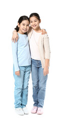 Fototapeta premium Cute Asian sisters on white background