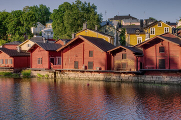 Fototapeta na wymiar 1800 19th century style red fishermen's harbor warehouses in Porvoo Finland 