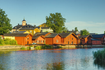Naklejka na ściany i meble Famous tourist attraction in Porvoo Finland, red fisherman warehouses next to the canal 