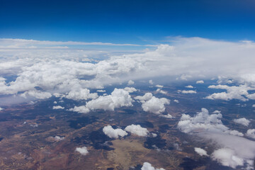 Fototapeta na wymiar Cloud top aerial view on blue sky beautiful natural landscape from airplane window.