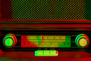 Retro radio receiver on dark color background, closeup