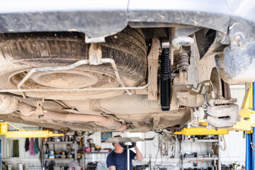 lifted old car with new rear shock absorber