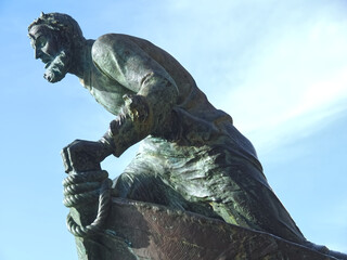 Sculpture of a sailor on a boat in a public park in Porto in Portugal