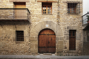 traditional stone facade of a 2-storey house 16th century architecture, Rubielos de Mora