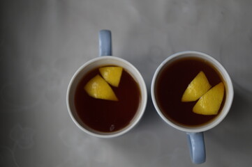 two cup of tea with lemon