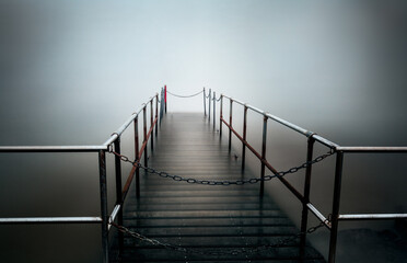 Mystical bridge surrounded by mist - horror concept