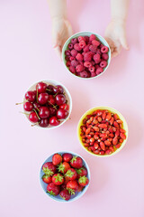Strawberry,cherry,raspberry berries in bowls
