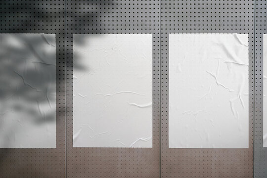 White paper poster mockup. Set of wet wrinkled and creased paper sheets with crumpled texture, blank posters glued to street wall or advertising column, mock up for design