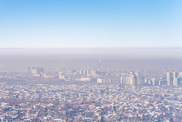 View of Almaty city and smog over it. Almaty, Kazakhstan.