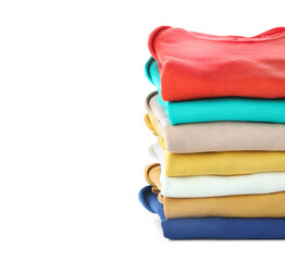 Stack of baby clothes on white background