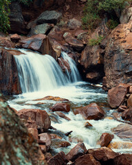 epic waterfall during the summer while hiking at a national park © Aon Prestige Media