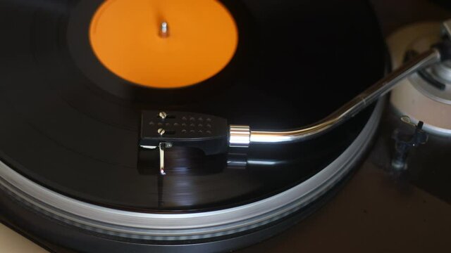 old vinyl record with clipping path. DJ Turntable with Vinyl Record, Playing, Top View. Close up at the needle on turntable