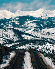 epic highway leading into the mountain landscape during winter