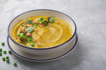 A proper nutrition dish made of organic vegetables decorated with crackers, herbs and green peas