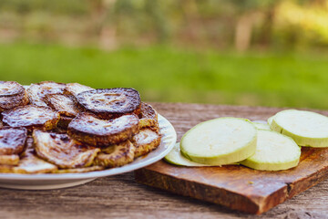 Home made  organic fried zucchini with  garlic yogurt sauce on wooden background