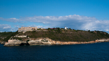 Fototapeta na wymiar View of the Castillo del Morro castle from the sea side in the Santiago de Cuba and light house for entrance to the bay.