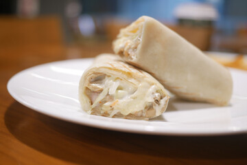  close up of vegetable roll on table at cafe